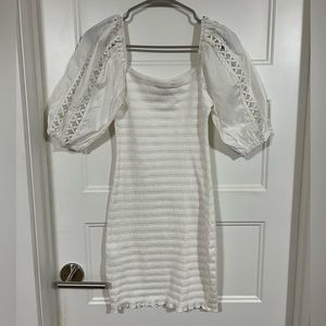 White, form fitting dress.